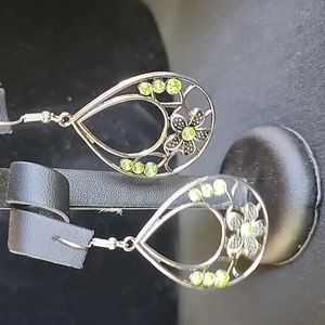 Silver toned earrings with green stones